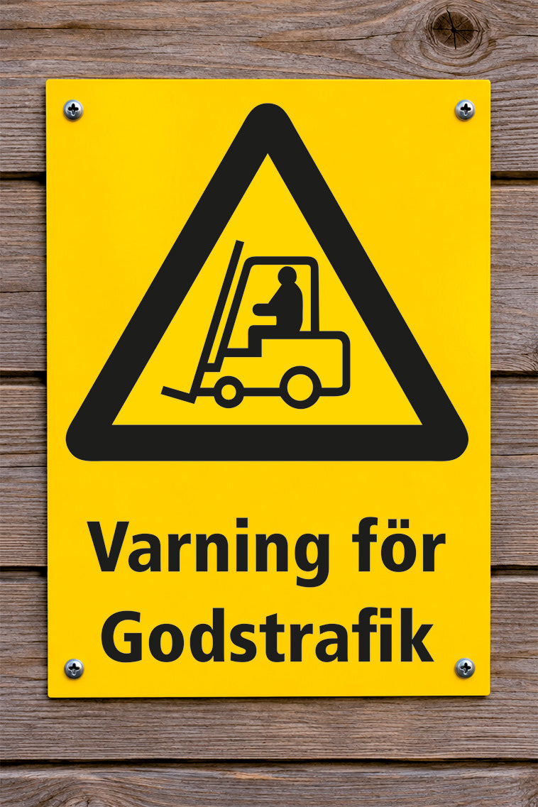 Varningsskylt på trävägg, Godstrafik
