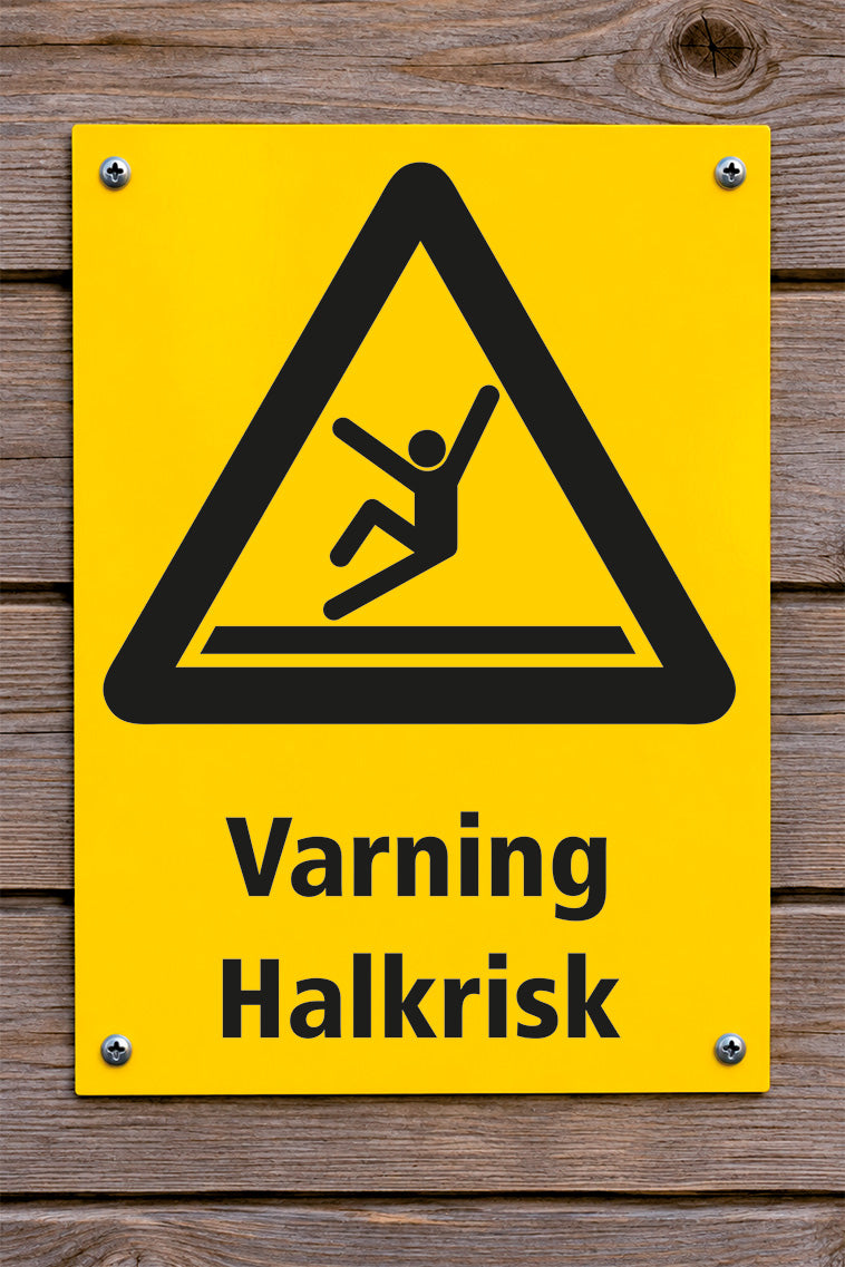 Varningsskylt på trävägg, Halkrisk
