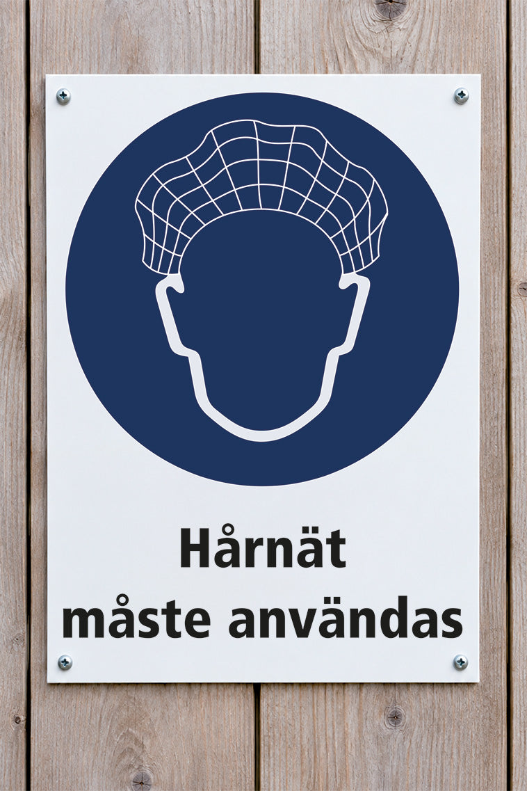 Påbudsskylt på trävägg, Hårnät måste användas