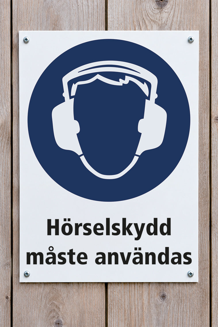 Påbudsskylt på trävägg, Hörselskydd