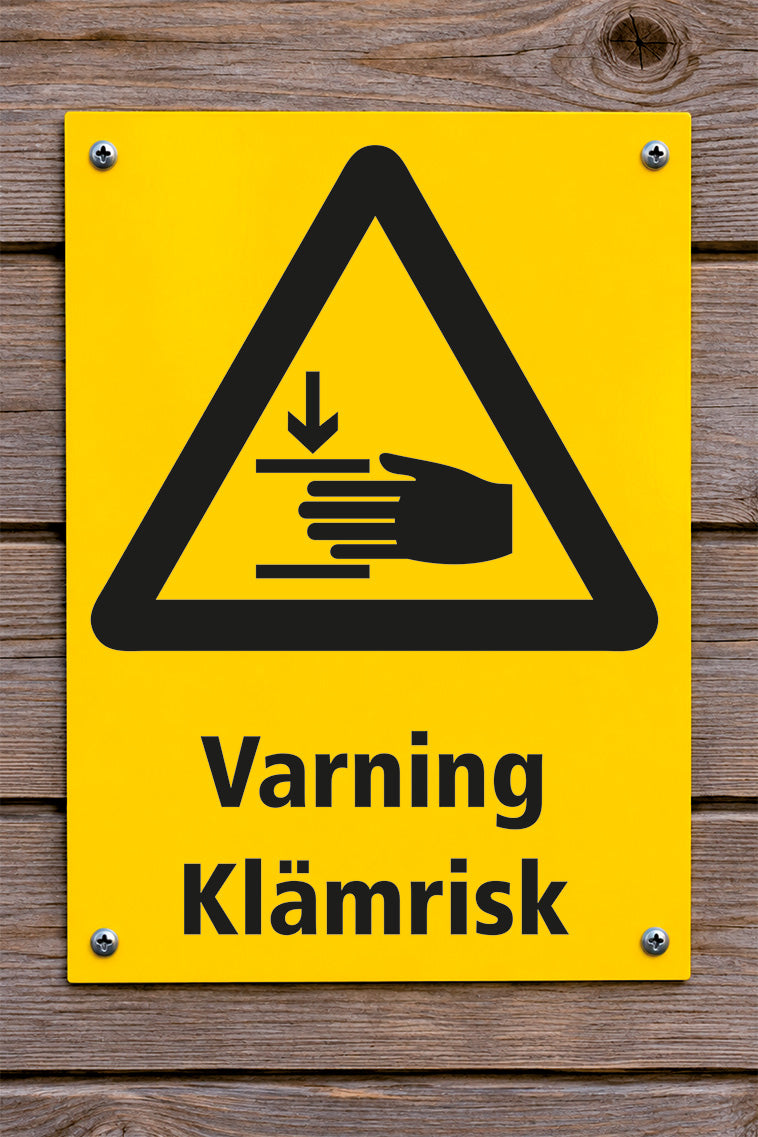 Varningsskylt på trävägg, Klämrisk