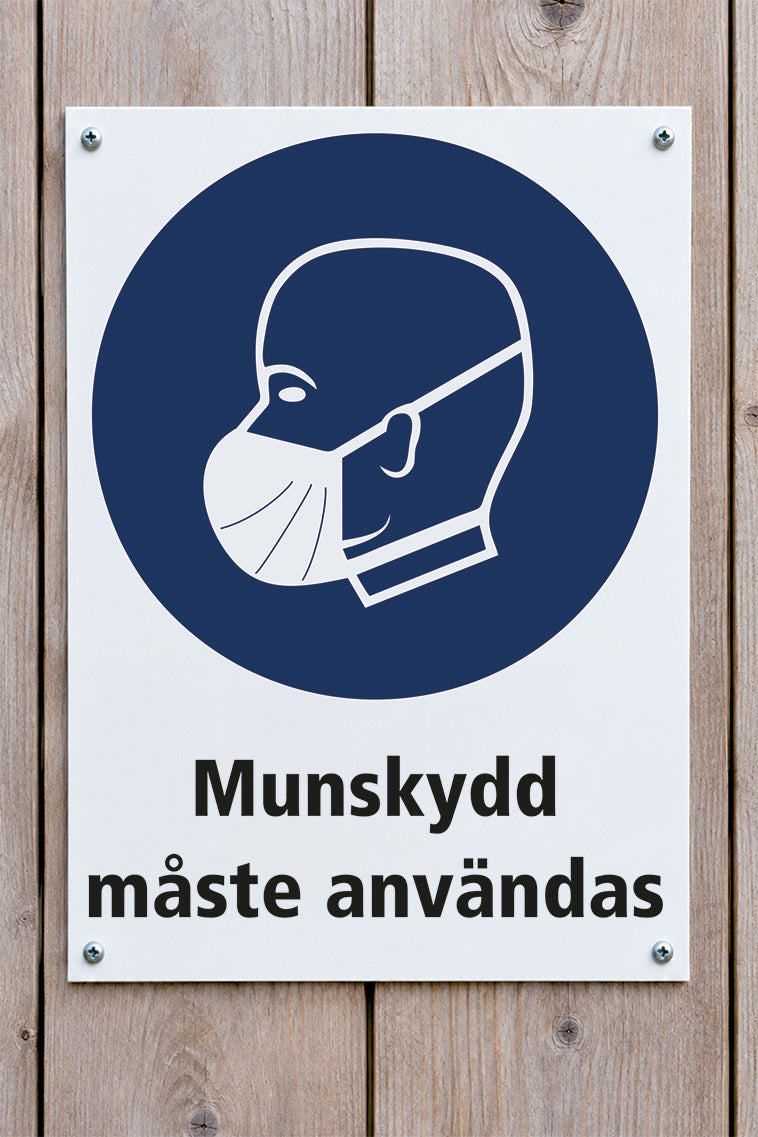 Påbudsskylt på trävägg, Munskydd