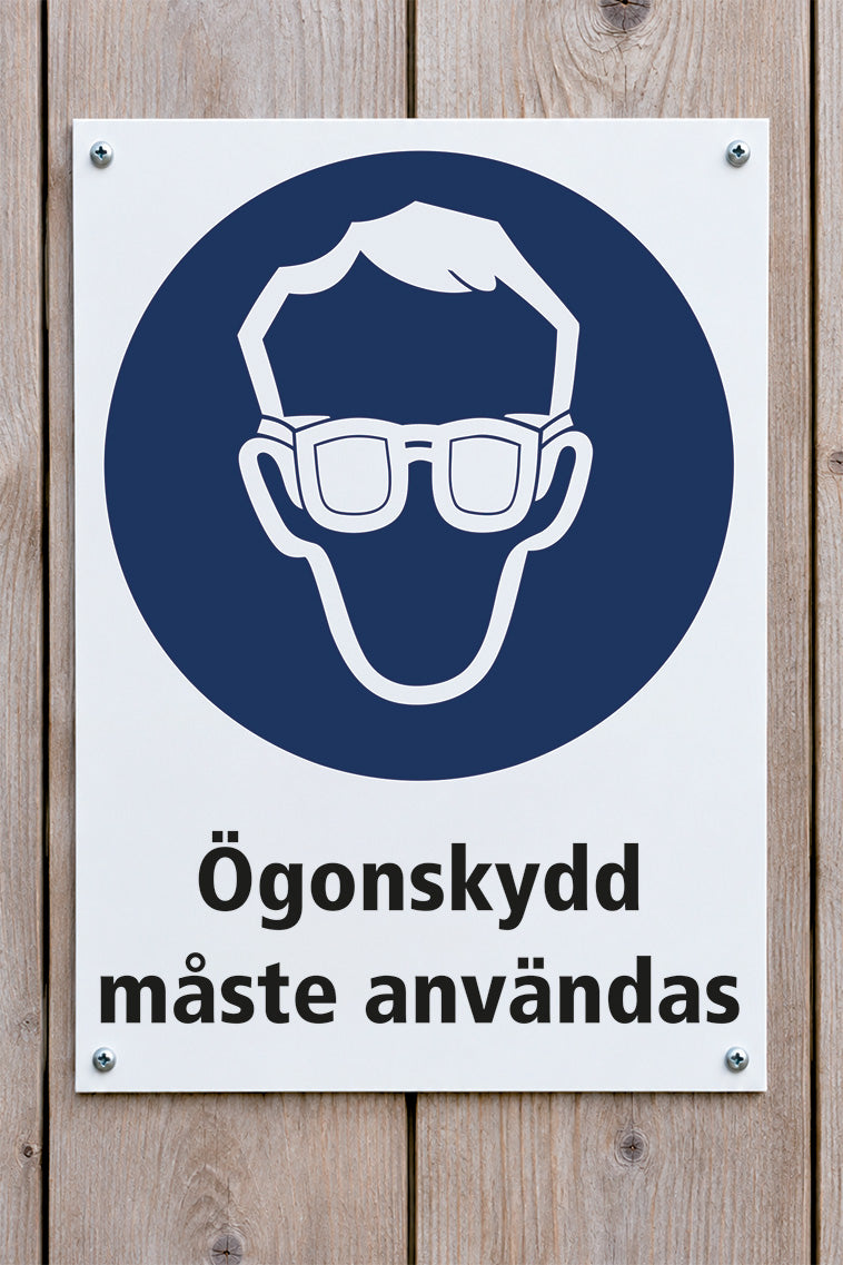 Påbudsskylt på trävägg, Ögonskydd
