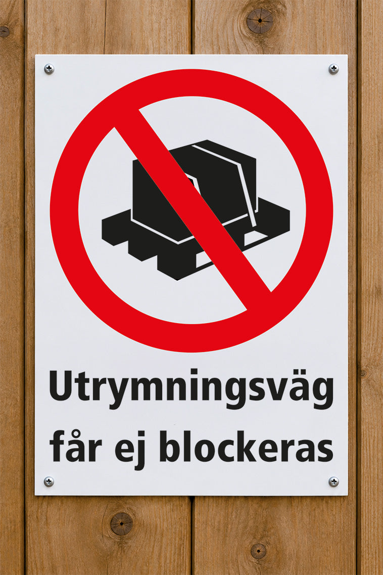 Förbudsskylt på trävägg, utrymningsväg