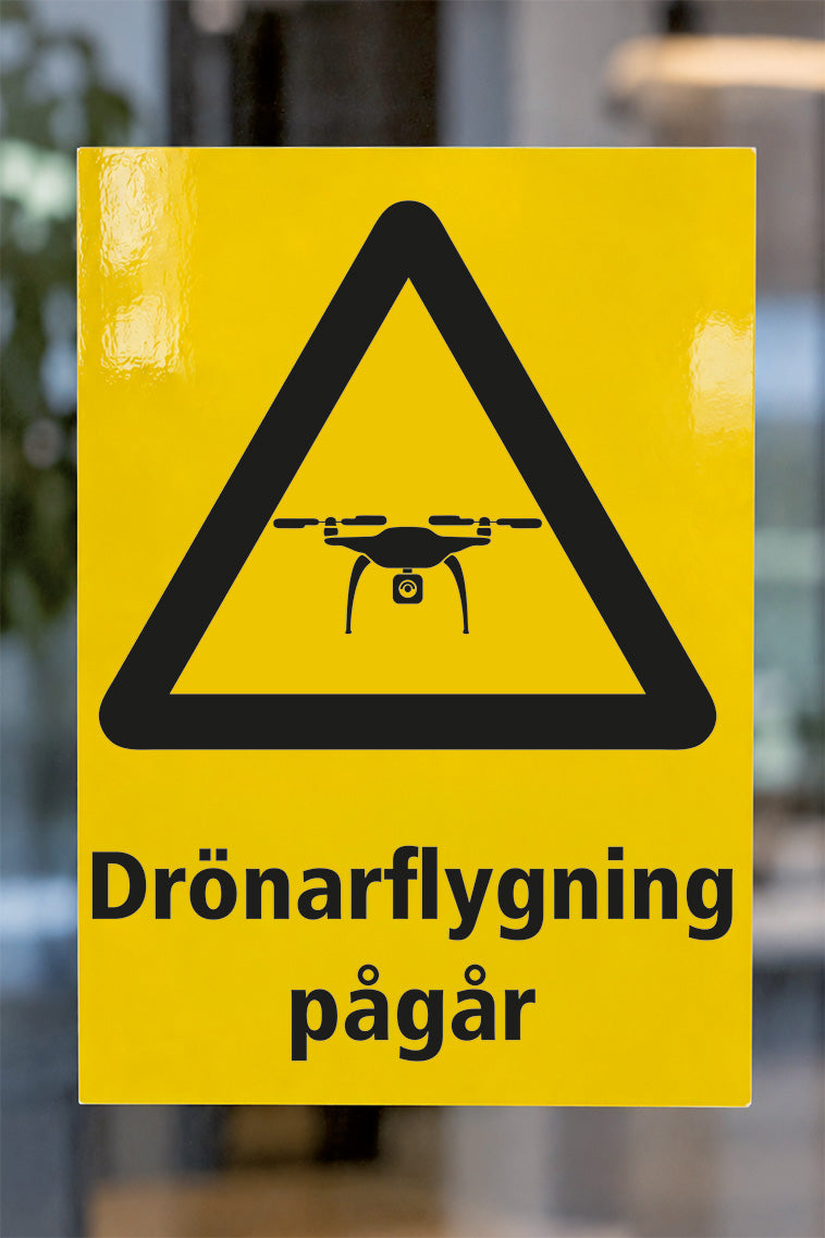 Varningsdekal på glas, Drönare